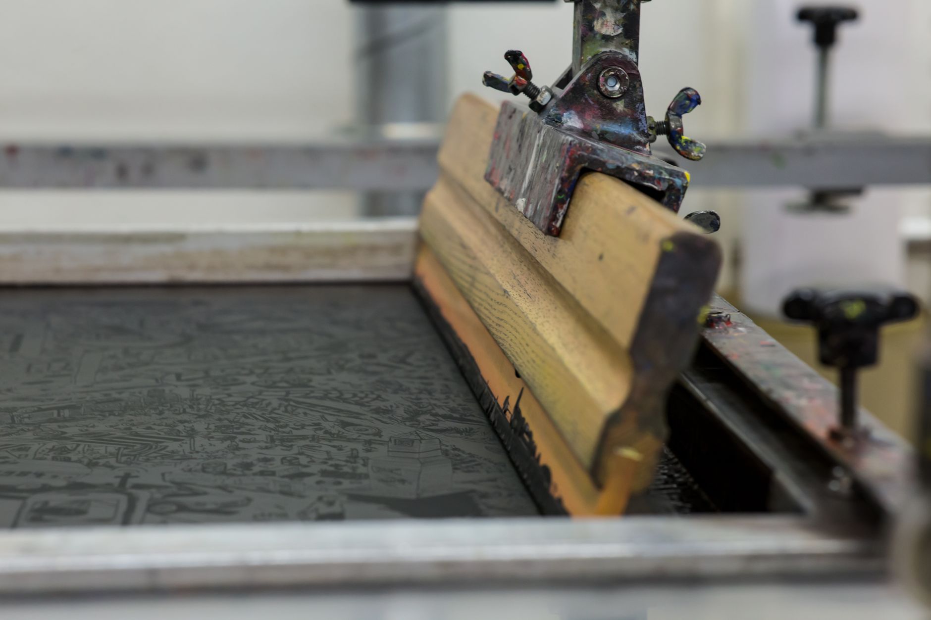 Custom screen printing process and typographic design layouts